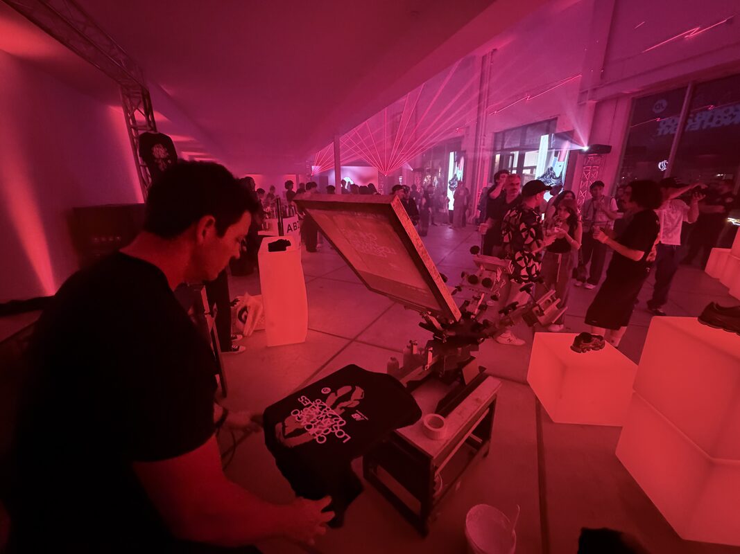 UV DTF station wrapping tumblers and hard goods at an event